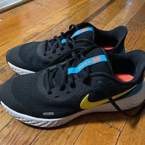 Nike revolution sneakers. Like new. Wore once or twice. Size 6.5 Big boys